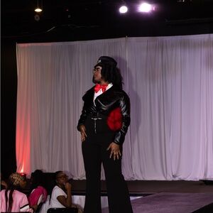 Chic Black Leather Jacket With Tuxedo Jumpsuit with Red Accents